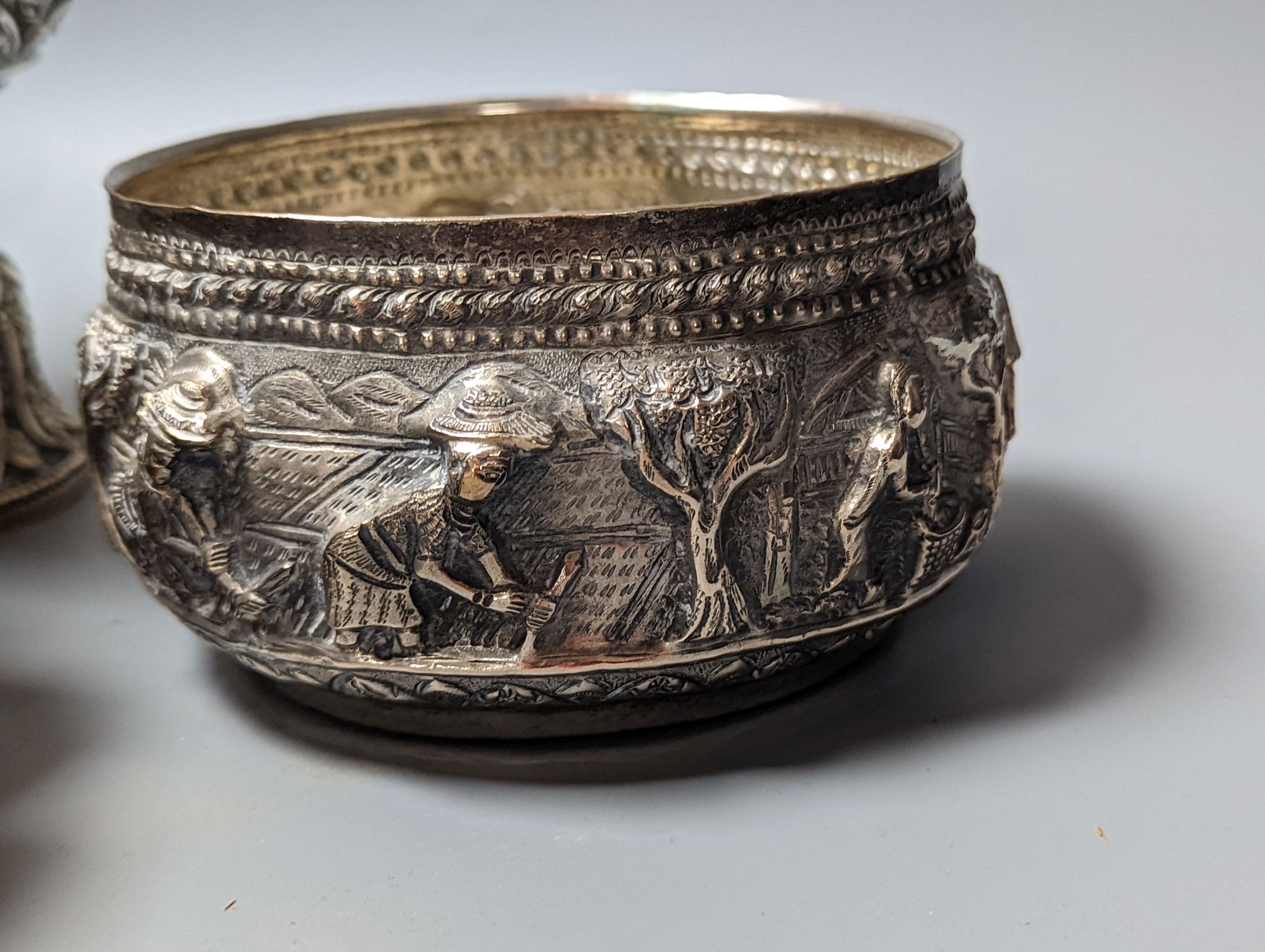 Six assorted embossed white metal bowls, including Indian and Thai, tallest 13.6cm.